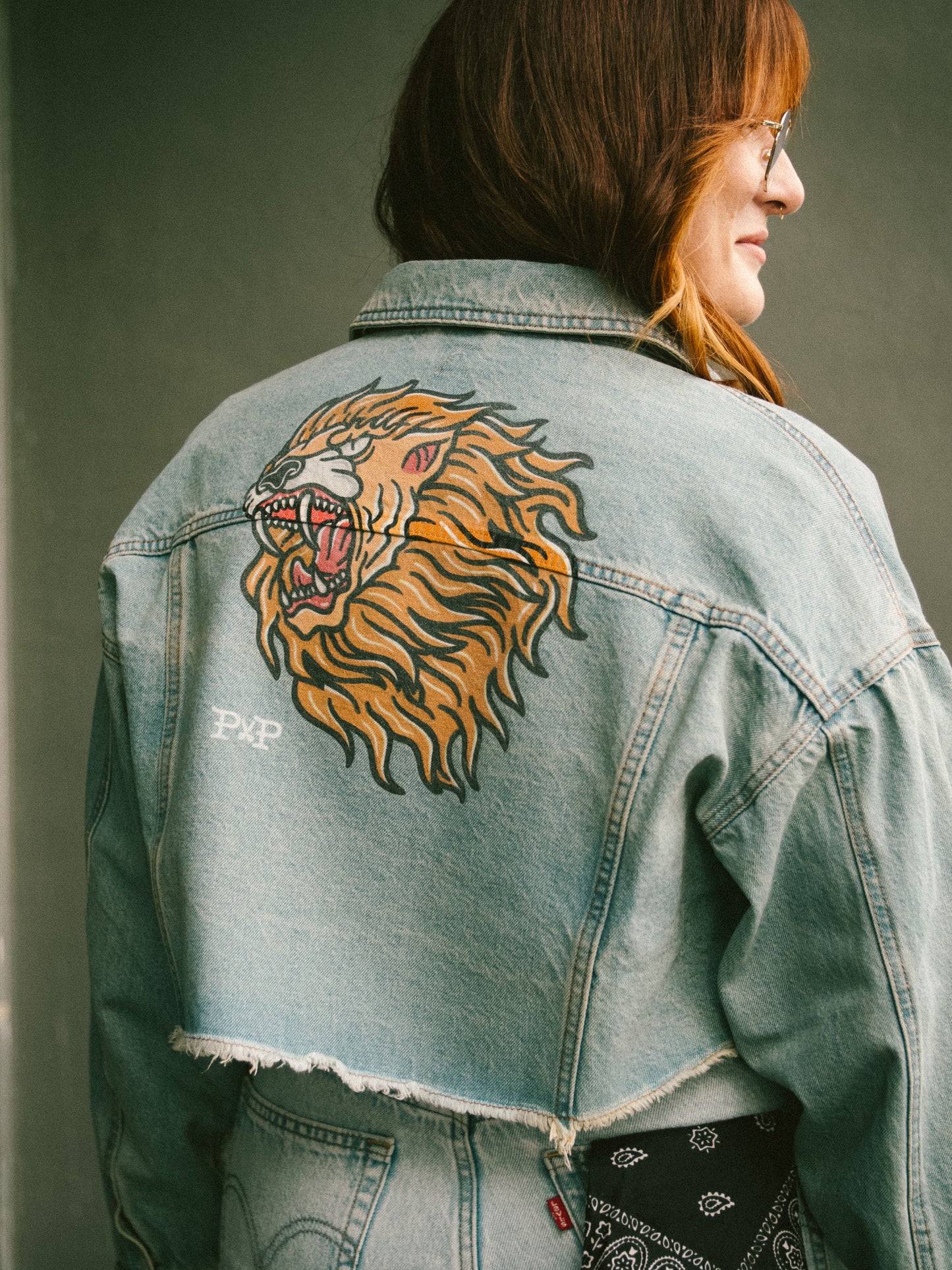 The Lion cropped light wash denim jacket