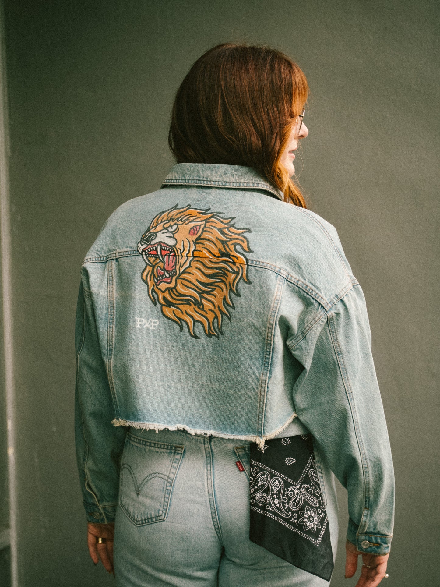 The Lion cropped light wash denim jacket